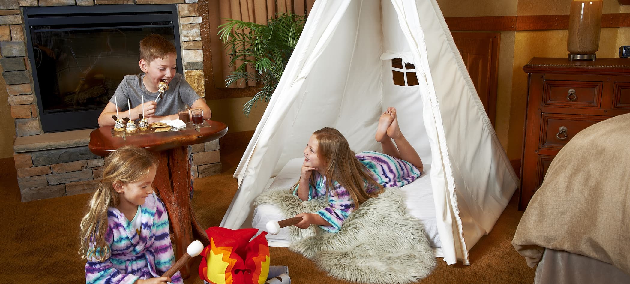 Camping in room with test and camp fire